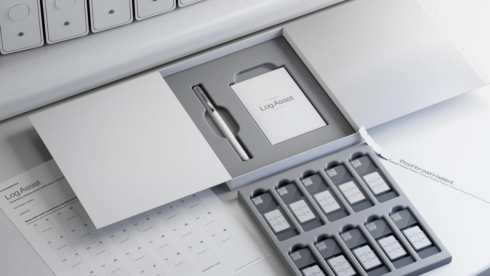 An open Prova V1 kit: ten slides in a tray beside a Log Assist card and a printed Log Assist sheet